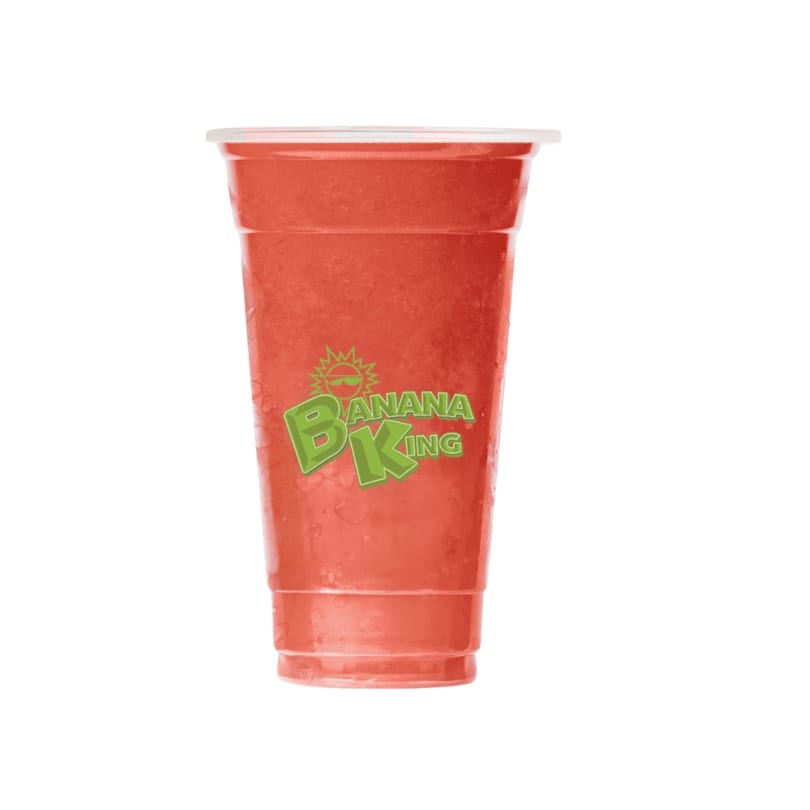 A clear plastic cup filled with a red smoothie, featuring the green Banana King logo.