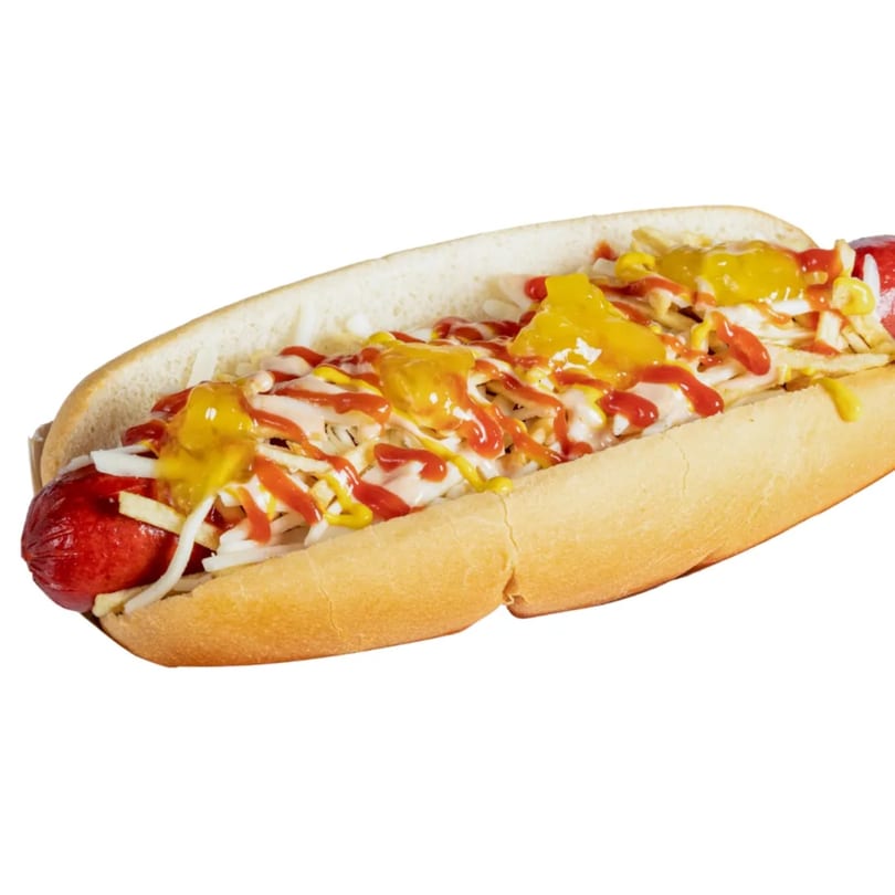 A Banana King hot dog with ketchup, mustard, mayonnaise, onions, and potato sticks.