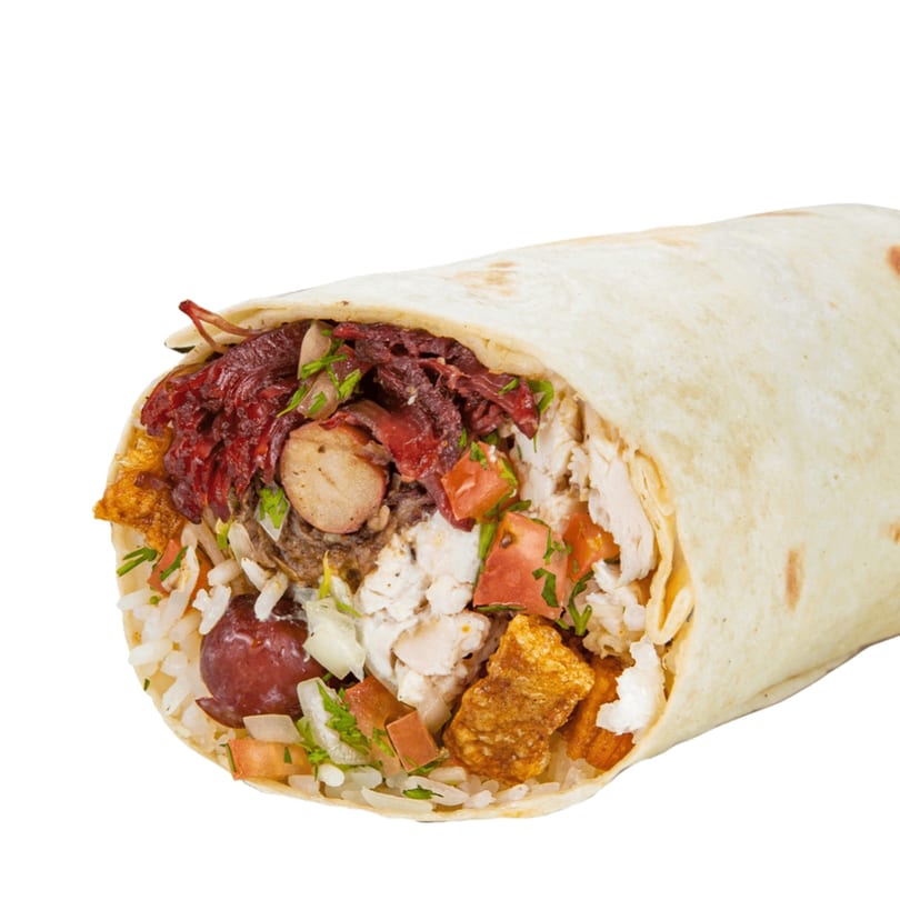 A large Banana King burrito, bursting with rice, beans, chicken, pork, and vegetables.