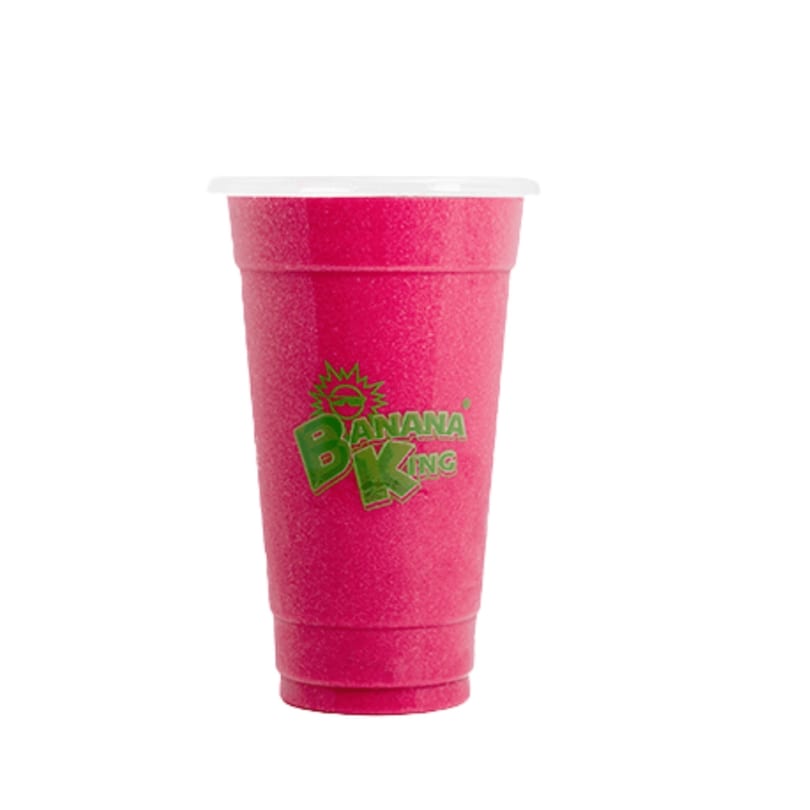 A vibrant pink Banana King smoothie in a clear plastic cup with a white lid.