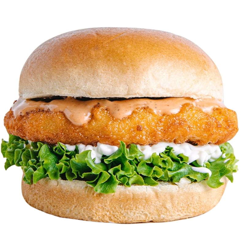 A Banana King crispy chicken sandwich with lettuce and two sauces on a bun.