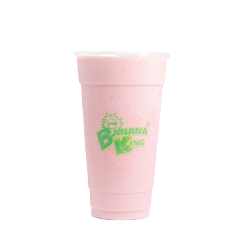 A pink Banana King smoothie in a clear plastic cup with a lid, against a white background.